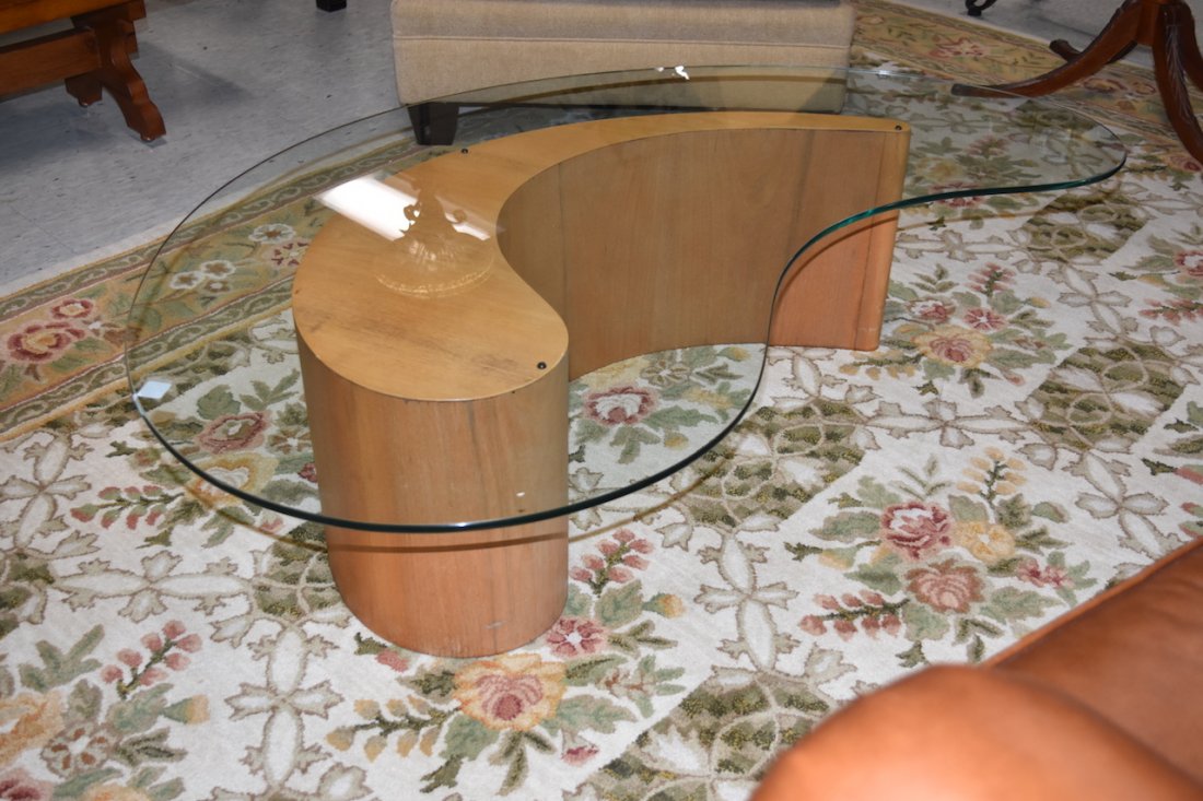 Comma Shaped Wood Coffee Table With Glass Top: Unique hollow wood coffee table in the shape of a comma with a complimenting glass top. This modern style table is in fair to good used condition with wear from use and age. It approx. 14 1/2" tall x 
