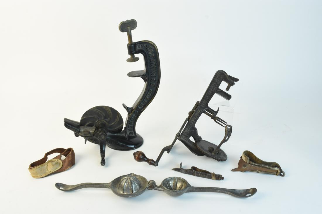 Primitive Kitchen Hand Tools - Pitter, Peeler +: Primitive hand crank Enterprise Cherry Stoner, pitter No. 1463, 13" H. Cast iron Apple Peeler, Turntable made by Goodell Co., USA, pat. May 24, 1898. Antique lemon, orange or garlic press. Corn husker