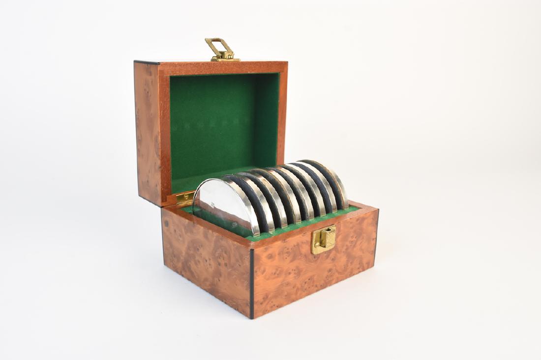 Burl Wood Box With Sterling Coasters: Finished burl wood hinged box with green velvet interior loaded with (8) weighted sterling silver coasters. Each coaster has a soft fabric on the bottom while the sterling is marked 925 with the initi