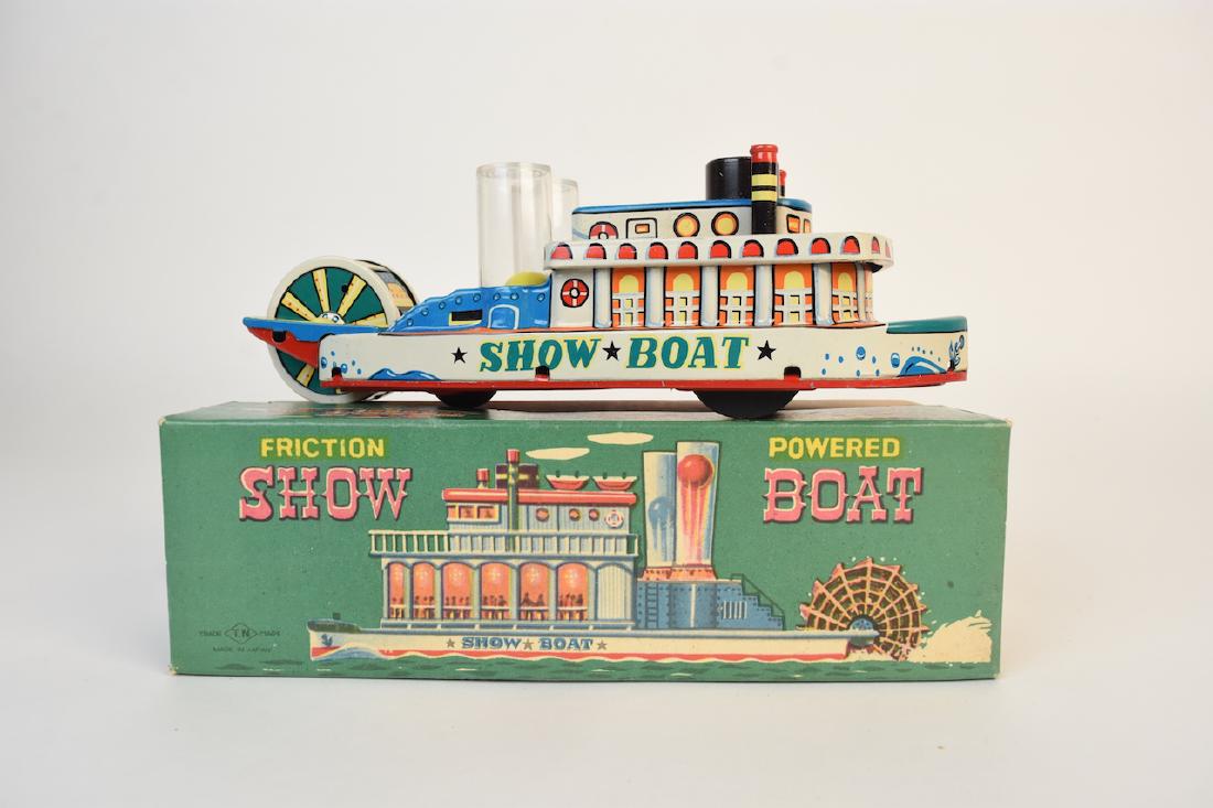Friction Powered Tin Litho Show-Boat; OB: Vintage friction powered tin litho Show-Boat toy in the original with the original packaging. This toy was made in Japan and is in like new condition. The box measures 8 1/2" x 3" x 2 1/2". Contact ou