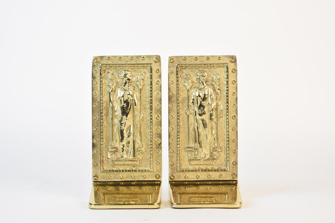 The Doors to the Library of Congress Bookends: Brass bookends painted gold depicting The Doors to the Library of Congress's Jefferson Building. The back of one is inscribed Intellectus while the other is inscribed Humanitas. These heavy bookends w