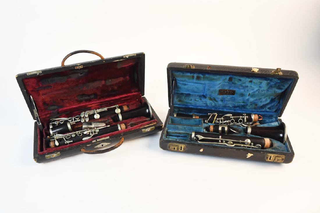 (2) Vintage Clarinet Woodwind Instruments: Two vintage clarinets. The first clarinet consists of several different makers. The Bell is marked J. Gras Brevete, the barrel joint is marked Selmer, made in France and the lower joint is faintly mar