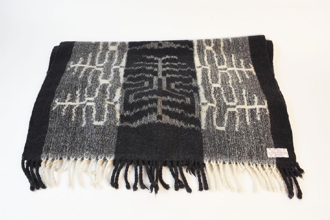 Guatemalan 100% Wool Rug by Fundap: 100% Wool rug made in Guatemala by the craftmanship of Momostenango. It comes in a gray, white and black geometric type pattern with twisted fringe on each end. It measures 5' x 2'4" and is in very go