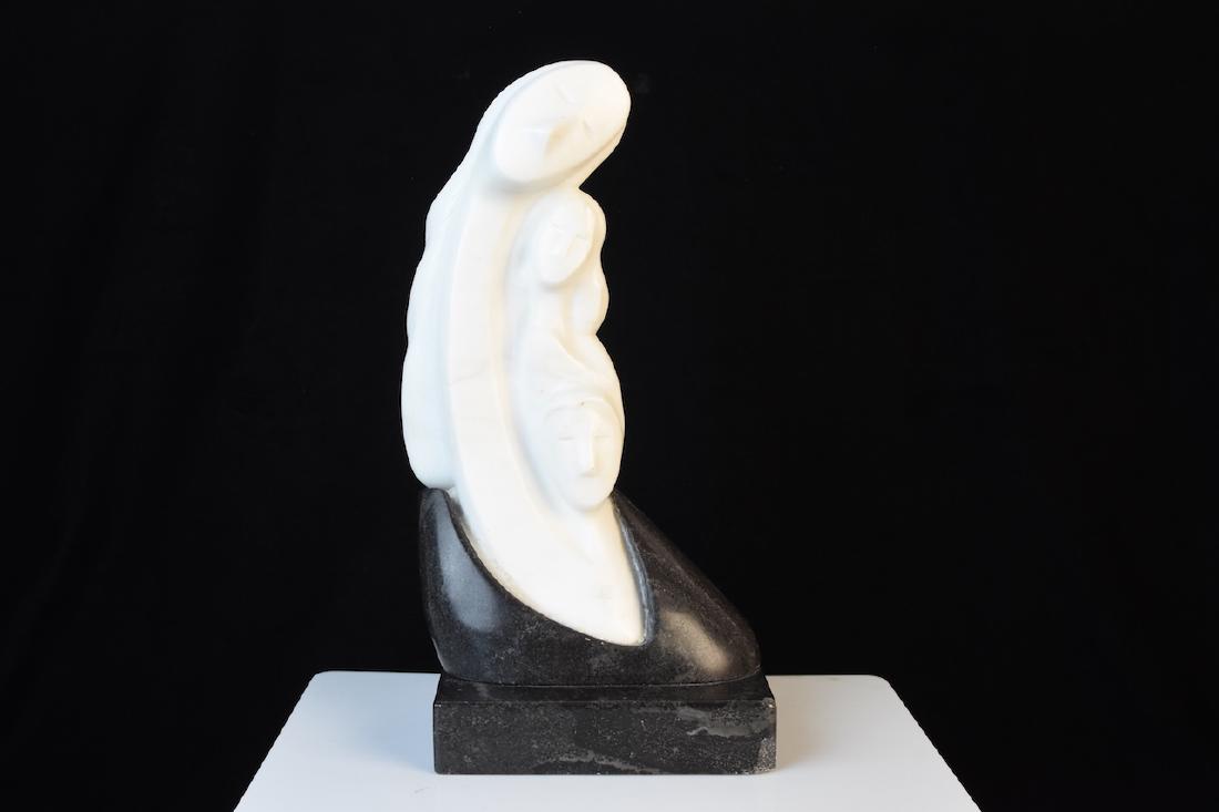 "Family of Women" Marble Sculpture by Yukuen: Elegant sculpture by Yukuen titled "Family of Women". The soft image is made of black and white marble on a black marble base. It stands 12" x 5 3/4". There is a chip on the marble base on the front r
