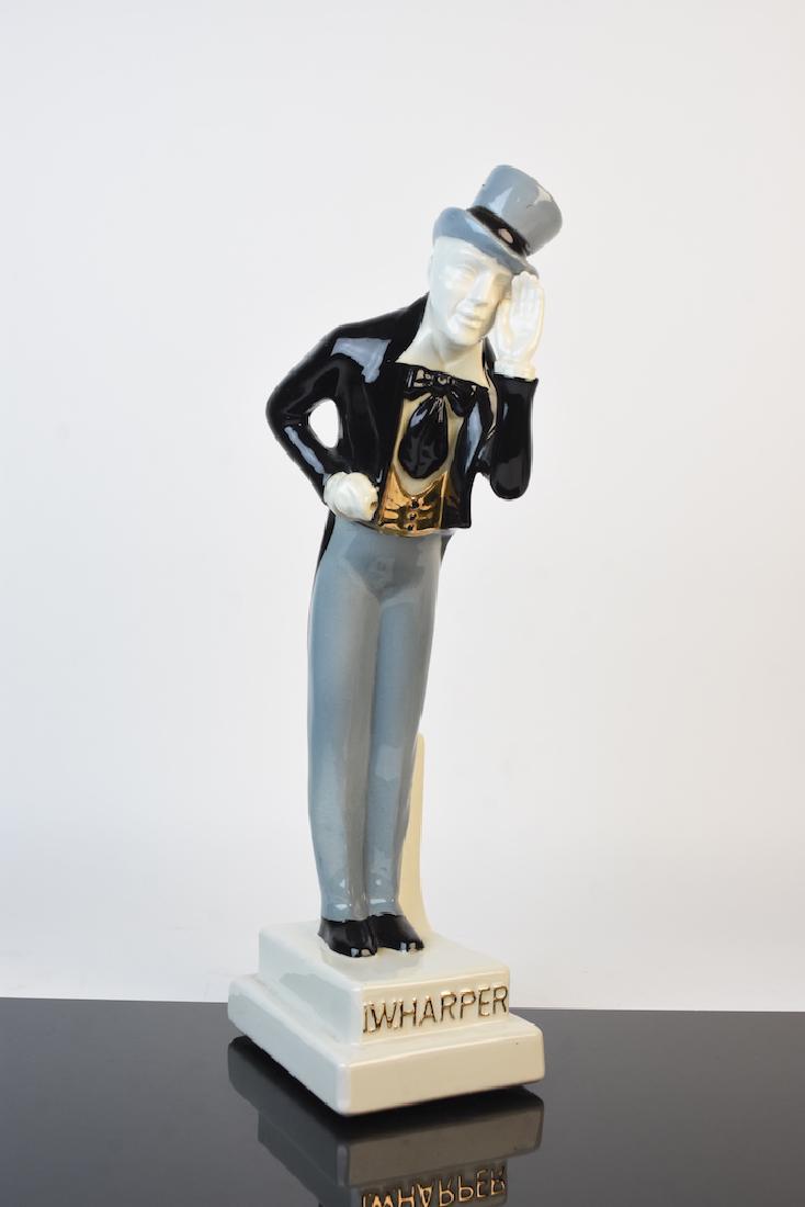 I.W. Harper Ceramic Bourbon Decanter: I.W. Harper figural decanter for Kentucky Straight Bourbon Whiskey. This ceramic gentleman has a removeable corked top hat used to refill the whiskey. He remains in very good condition although he is 