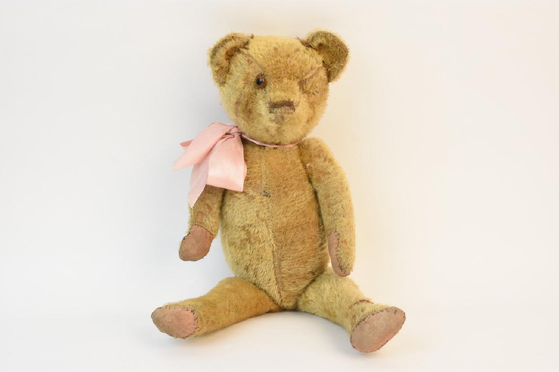 Early Teddy Bear w/ Fully Jointed Body: Early mohair teddy bear with fully jointed body, straw stuffed and amber glass eye. This old bear would make a great addition to any teddy bear collector. Bear measures 20" L. Bear has severeal areas