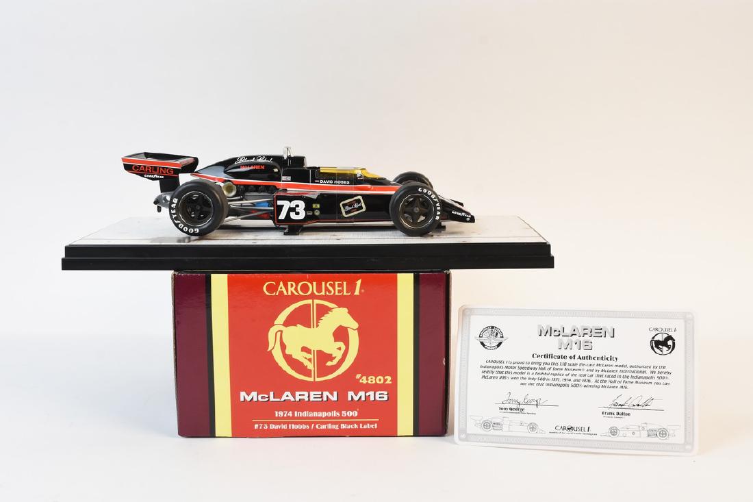 Carousel 1 McLaren M16 INDY 500 #73: Carousel 1 #4802 McLaren M16 Carling Black Label 1974 Indy 500 #73 David Hobbs. This 1:18 die cast model comes with COA and in the original box pictured. Car has never been displayed and is in excelle