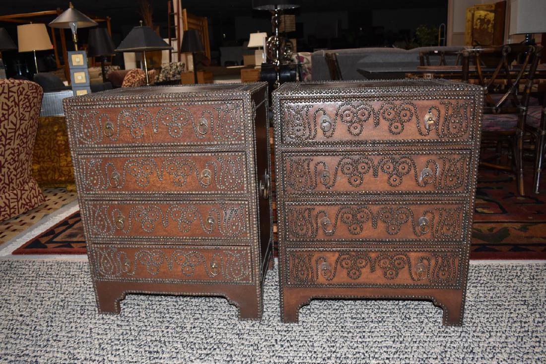 Pair of (4) Drawer Studded Side Tables: Unique pair of (4) drawer side tables with studded designs throughout. These side tables have a leather texture over wood surface and a fleur-de-lis pattern on top. Both remain in good lightly used co