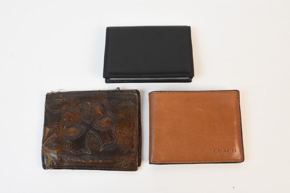 Men's Designer Wallets; Coach, Bosca, Nason: Assorted men's designer wallets including a black leather card and license holder by Bosca 1911 and a light brown leather bifold Coach wallet. Both of these wallets appear to never have been used. We
