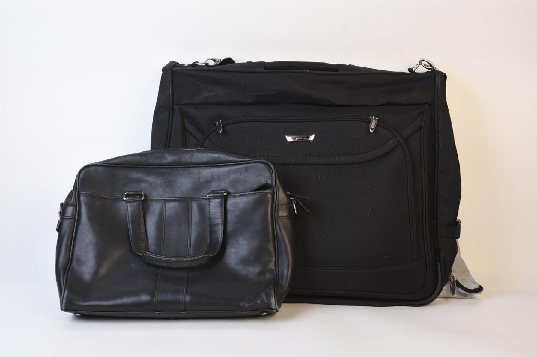 Men's Delsey and Coach Designer Bags: Delsey designer garment travel bag in black No. 22828 BK in like new condition. This nice light weight bag has most likely never been used as it still has the original paperwork and plastic over the l