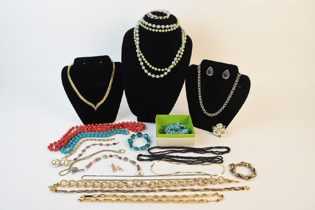 Costume Jewelry Including Monet and Napier: An assortment of costume jewelry including a Monet gold tone wheat link necklace; a BSK floral brooch; a Napier gold tone box chain necklace; a faux turquoise stone bracelet and necklace; a 14kt gold