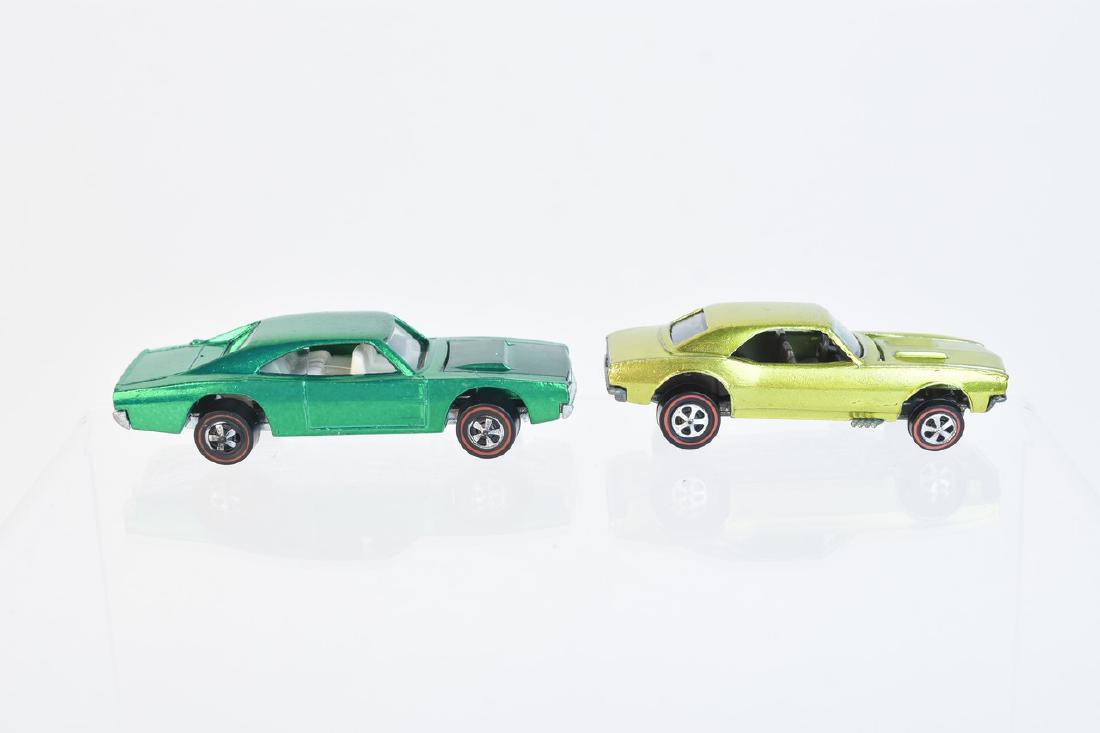 1968 & 1969 Redline Hot Wheels Charger & Camaro: A pair of Hot Wheels redline series cars including a 1968 antifreeze (Lime Yellow?) Custom Camaro with dark windows & interior; and a 1969 green Custom Dodge Charger with clear glass & white interior.