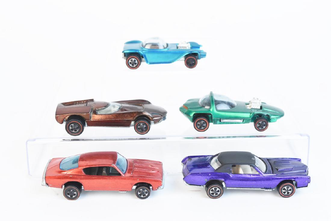 1968 & 1969 Redline Hot Wheels Cars: An assortment of vintage Hot Wheels redline series cars: green 1968 Silhouette; 1968 purple Custom Eldorado with white interior; 1968 light blue-green Beatnik Bandit; 1969 brown Turbofire; and a 1968