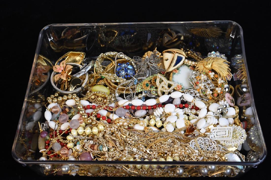 Costume Jewelry Including Trifari: An assortment of costume jewelry pieces. This lot includes necklaces, bracelets, and brooches. Brands include Sarah Coventry, Monet, Trifari, Napier, 1928, Avon, and more. Items sold as is, may be imp