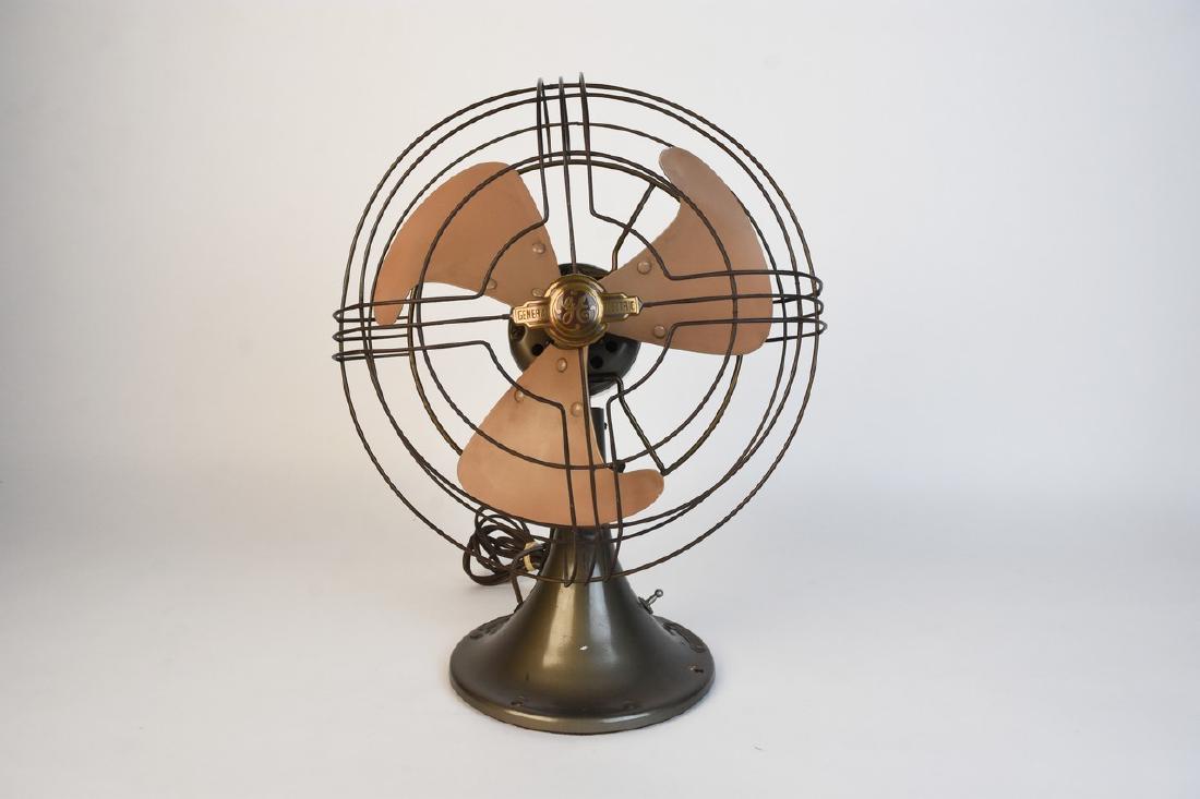 Vintage General Electric 3 Blade Fan; FM10V21: Vintage General electric oscillating 2 speed tilting fan; cat No. FM10V21. This art deco style fan is in good clean working condition. The diameter of the fan is 12". Contact our recommended 3rd party
