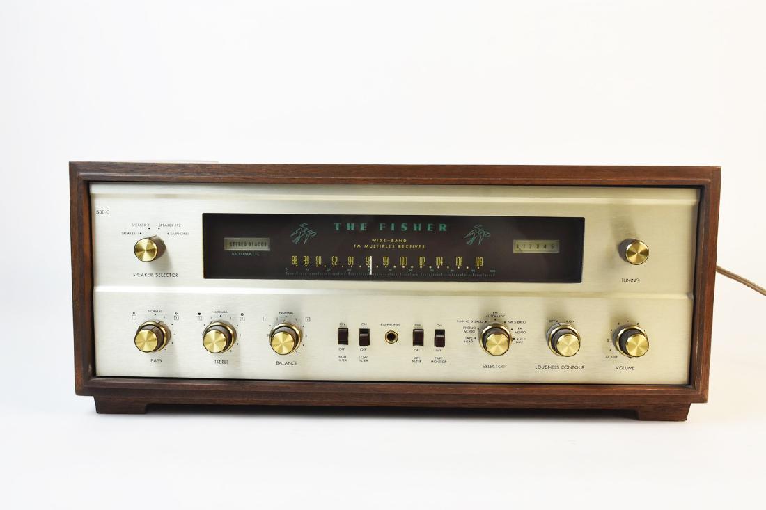 Fisher 500-C Walnut Stereo Receiver, 1960s: A Fisher 500-C walnut cased stereo receiver. This model includes its original instructions and warranty. There is no backing, interior is dusty, and the front shows areas of discoloration. Toning to p