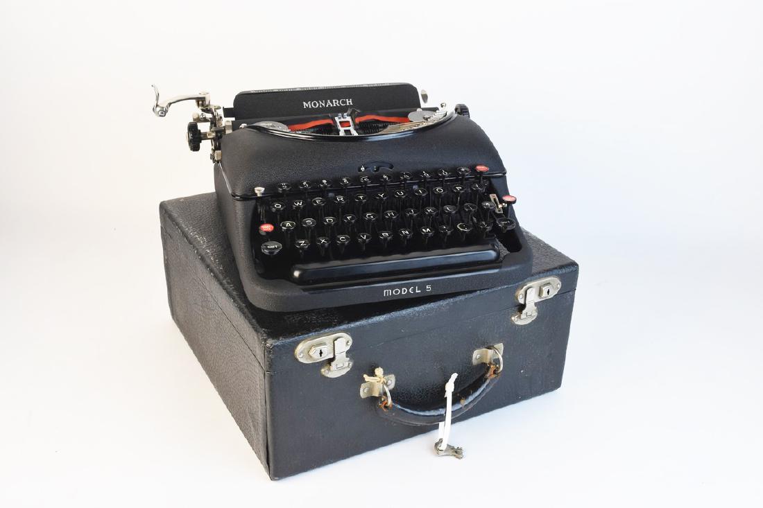 Remington Rand Model 5 Monarch Variant Typewriter: A vintage Remington Rand Model 5 Monarch variant typewriter dating to the late 1930s. It is presented in its original case with two keys included. Typewriter appears to be in working condition, not fu