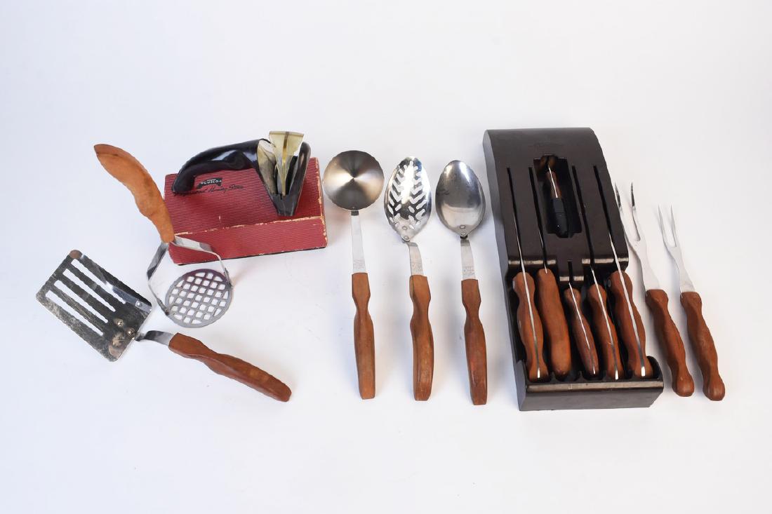 Cutco Knife and Serving Sets: A collection of Cutco utensils and knives including a brown caddy. The pieces are presented with light brown handles. Includes No. 22, No. 24, No. 25, No. 20, No. 15, No. 27, No. 12, No. 28, No. 13, N