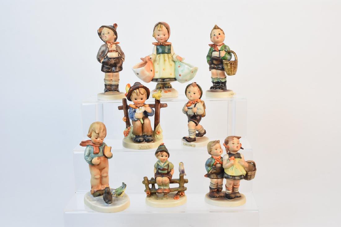 Eight Vintage Hummel Figurines: A lot of eight vintage Goebel Hummel figurines including #51 "Village Boy" TM5; #49 "To Market" TM2; #74 "She Loves Me, She Loves Me Not" TM3; #82 "School Boy" TM3; #95 "Brother" marked "Germany" to i