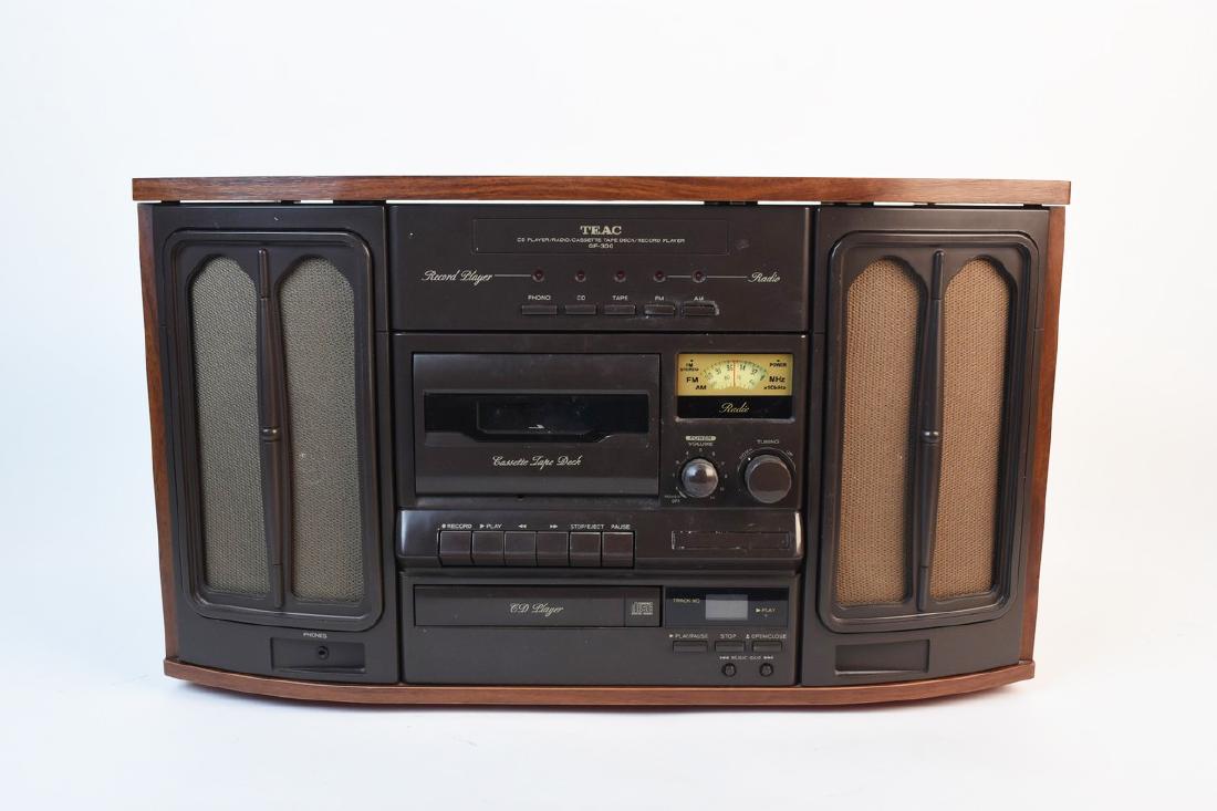 TEAC GF-300 Compact Stereo: A TEAC GF-300 compact Hi-Fi stereo system presented with a vintage aesthetic. Includes record player, cassette player, CD player, and AM/FM radio. Dusty; powered on but not otherwise tested. Includes