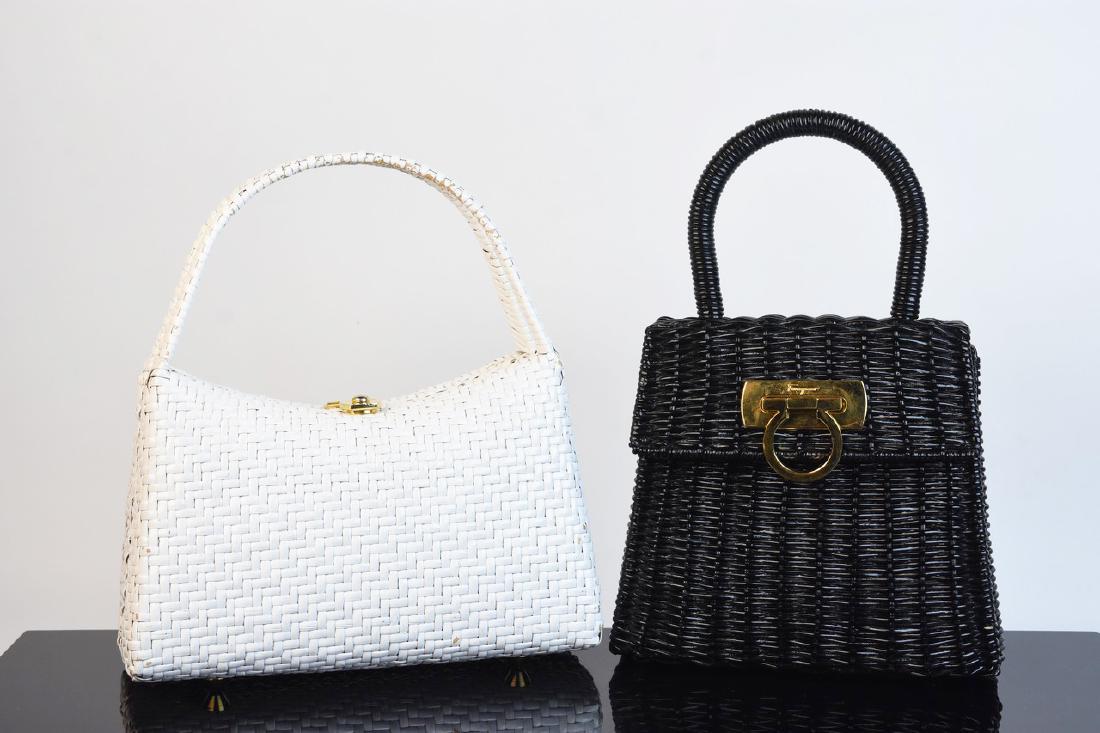 Wicker Handbags Incl. Ferragamo: A pair of vintage wicker purses. The pair includes one by Salvatore Ferragamo that is painted black with a brass tone closure. The other is by Neiman Marcus and it is painted white. Both bags open to