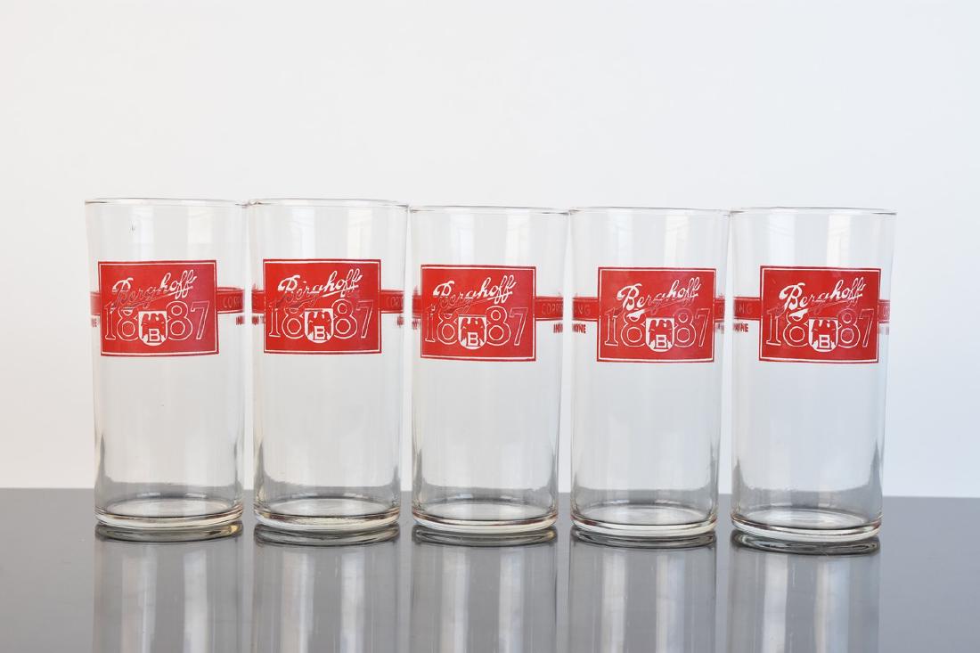 Vintage Berghoff Tumblers: A collection of five glass tumblers from the Berghoff Brewing Company of Fort Wayne, Indiana. They are marked to their front "Berghoff 1887." Some loss of paint and dust residue. They measure approxim