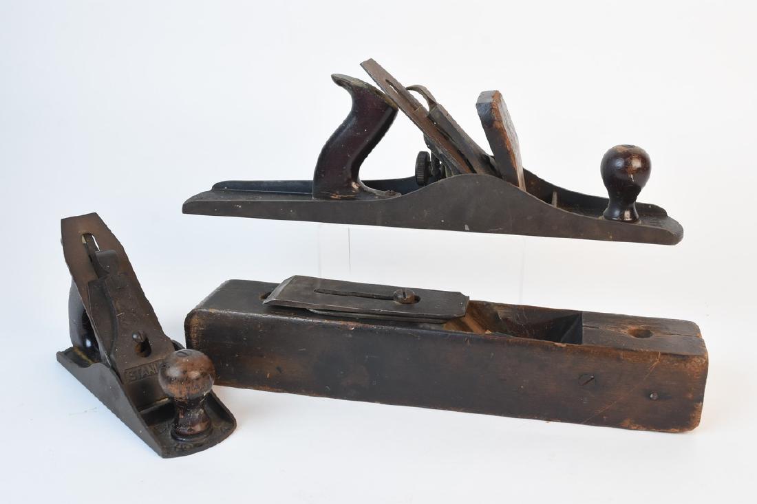 Vintage Wood Planes: A lot of three woodworking moulding planes including two by Stanley. Very dusty; surface wear and residue; cracks and chips; discoloration; oxidation to metal. Largest measures approximately 16" D x 2