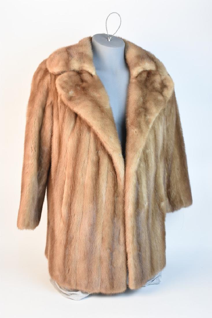 Mark Pearlman Mink Fur Coat: A coat from Mark Pearlman's Anderson Fur Company. The coat features two hidden closures at the front & two front pockets. Interior tear and some threads are loose. Sleeve length: 23"; Shoulder: 18.5";