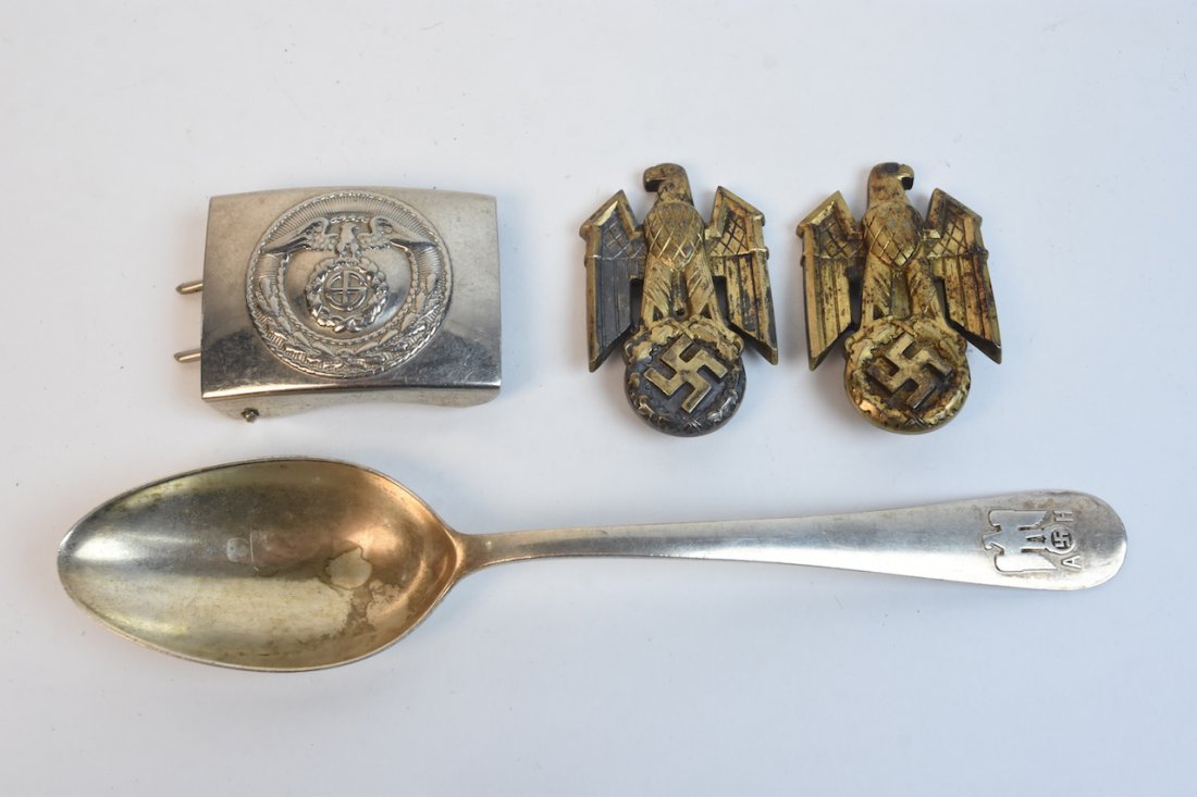 Nazi 800 Silver Spoon + More: An 800 silver spoon stamped with a hallmark to its underside and featuring a Nazi Eagle, swastika, and "A H" (presumably for Adolf Hitler) to its end. Also included are two Nazi Eagle emblems and a be
