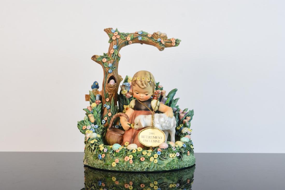 Goebel 2001 Retirement Exclusive: A pairing of two Goebel Hummel figurines including a limited edition "Easter Morning" decorative stand (2000). Also included is a Retirement Exclusive "Favorite Pet" figurine (2001). Very minor markin