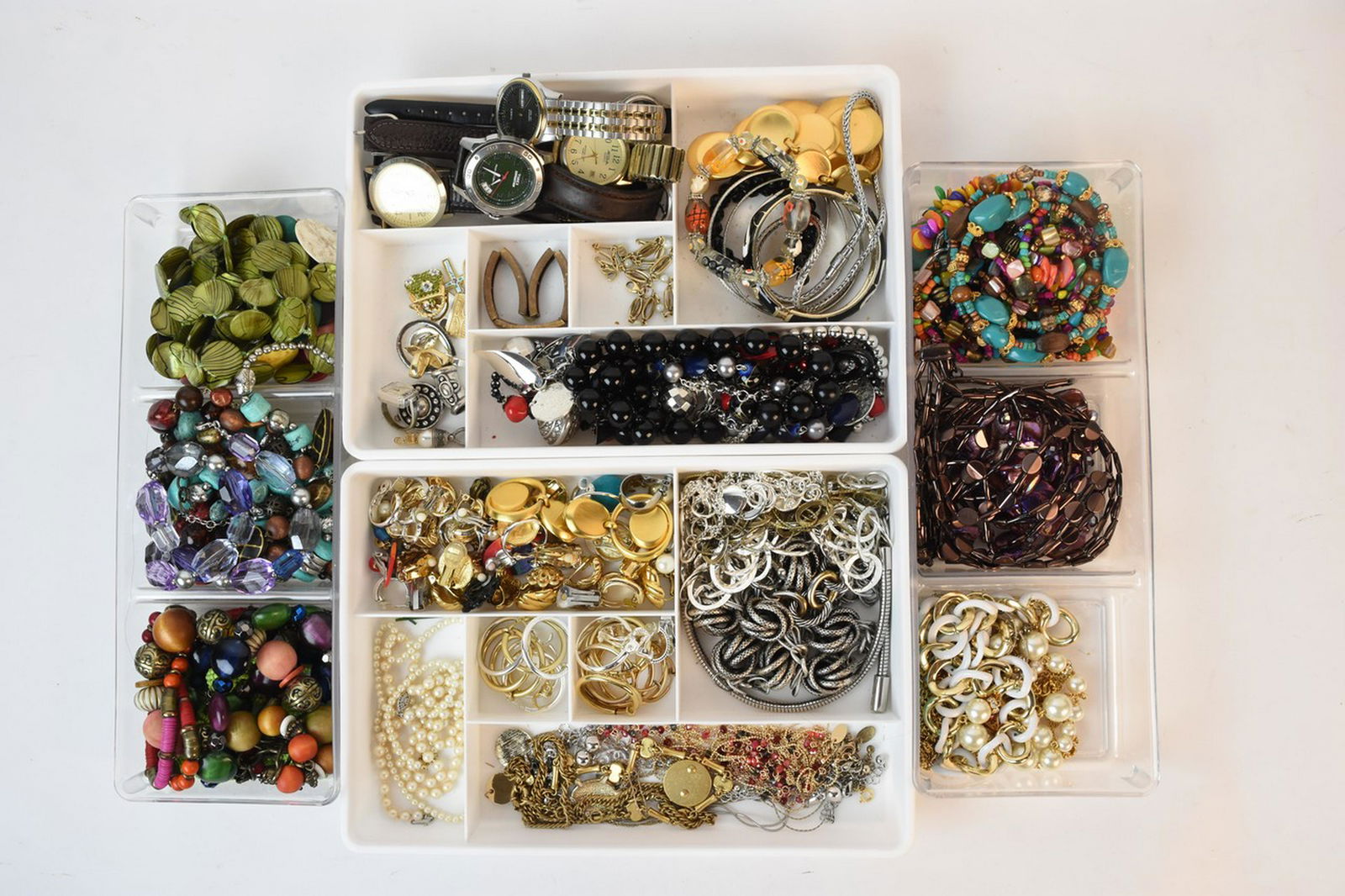 Assorted Costume Jewelry Incl. Napier: A large assortment of costume jewelry including brands such as Monet, Napier, Christian Dior, Timex, and Jones NY. Items include clip-on earrings, beaded necklaces, statement necklaces, bracelets, and