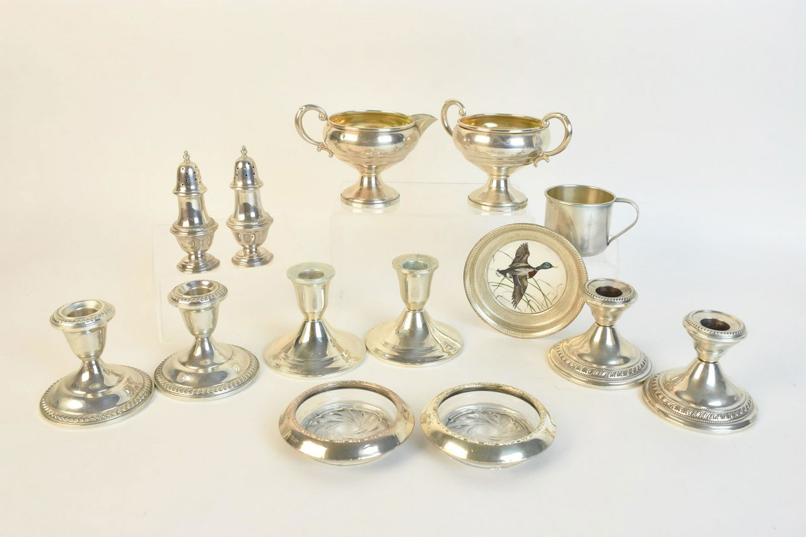 Sterling Silver and Weighted Sterling (3.50 ozt): An assortment of sterling silver (approx. 3.50 ozt total sterling weight), weighted sterling, and reinforced sterling pieces including a porcelain "Mallard" coaster with a silver band marked "Exclusiv