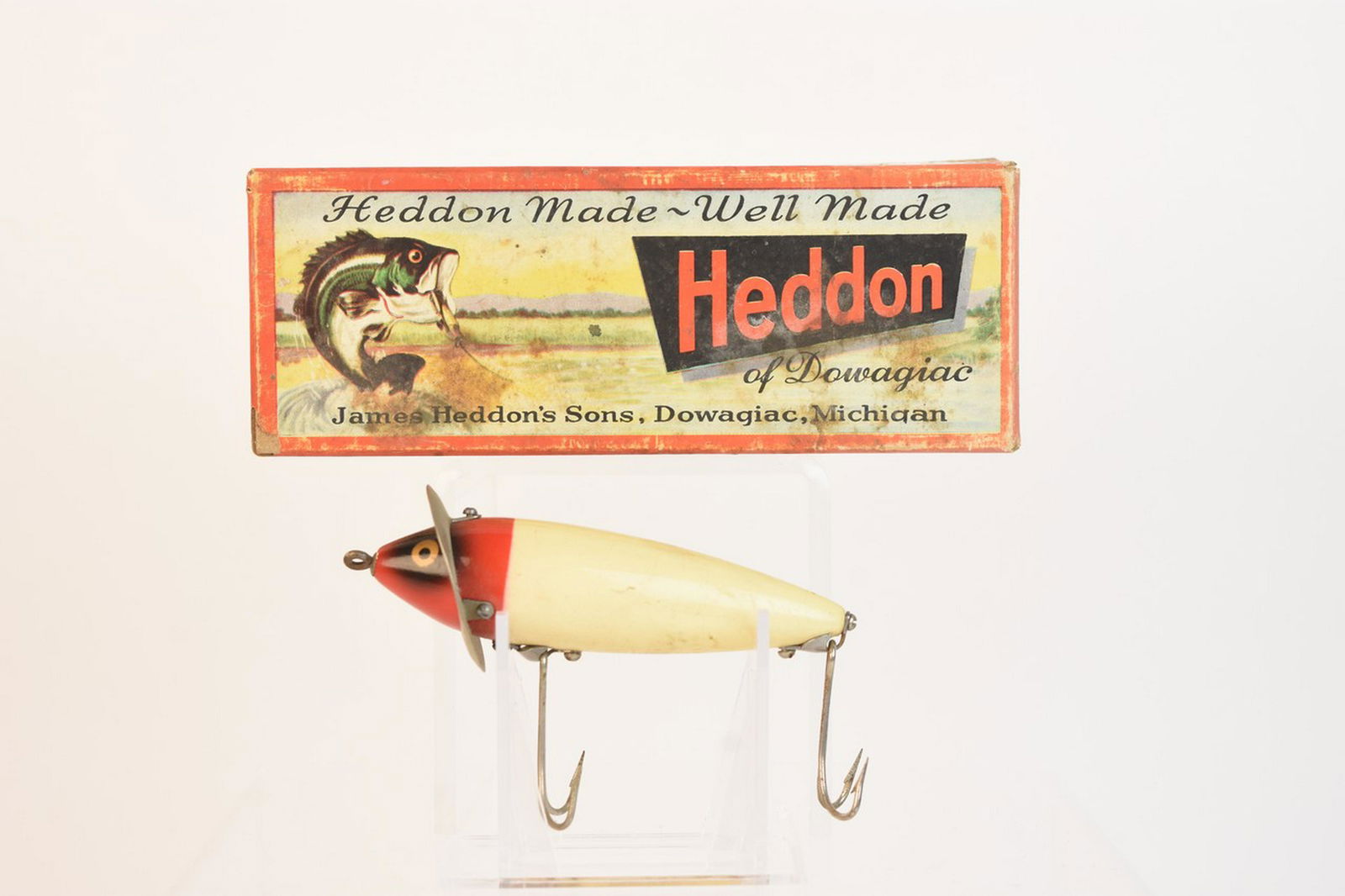Heddon 210 Surface Fishing Lure W/ Box: Heddon 210 Surface fishing lure with box. Contact our recommended 3rd party "for profit" shipper Pak Mail at (260) 637-4809 or contact@pakmailfw.com for shipping quote PRIOR to bidding. Scheerer McCul