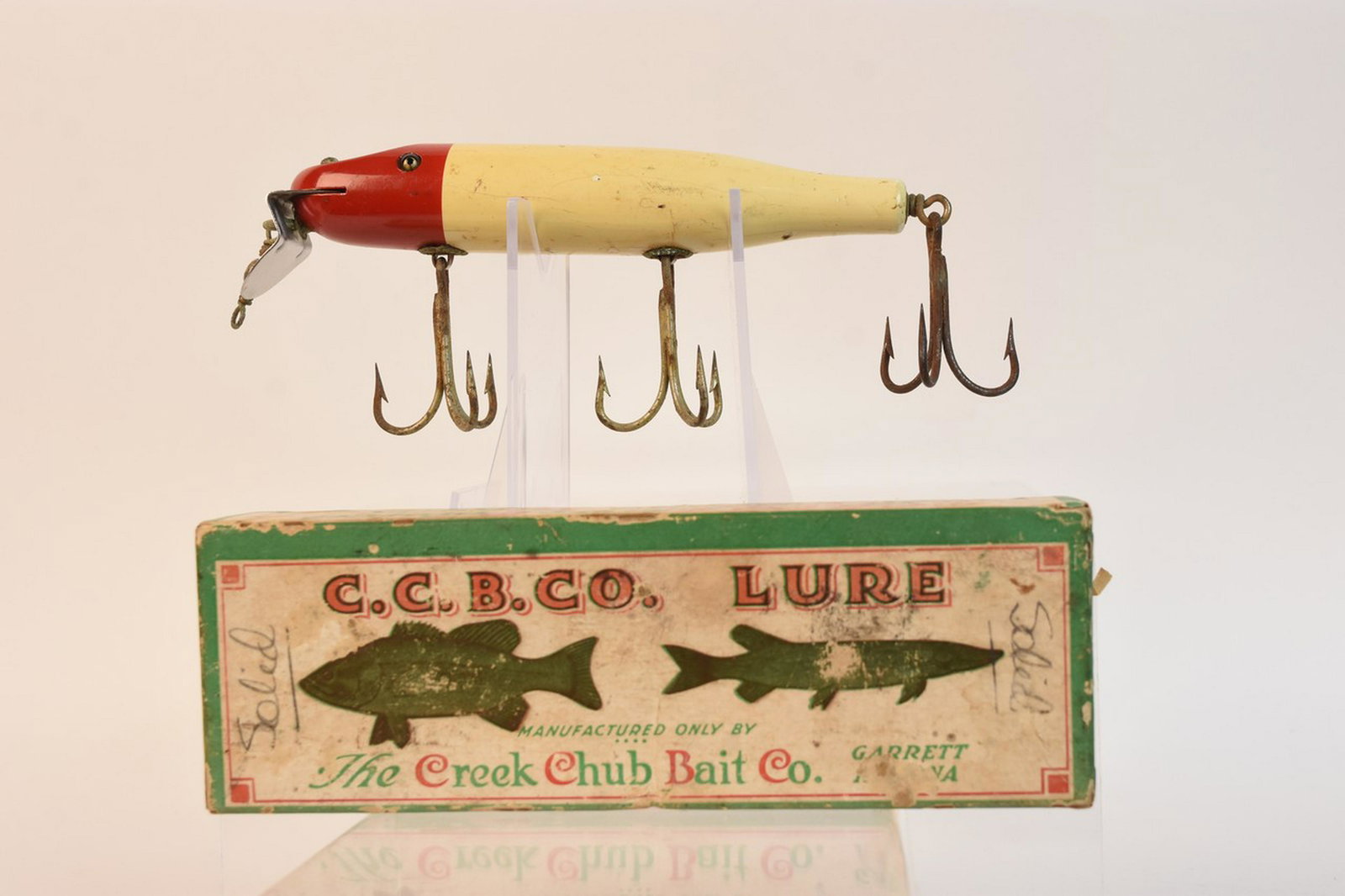 Creek Chub Huskie Pikie Minnow w/ Box No. 2302: Creek Chub Huskie Pikie fishing lure white and red with box No. 2302. Contact our recommended 3rd party "for profit" shipper Pak Mail at (260) 637-4809 or contact@pakmailshipsfortwayne.com for shippin