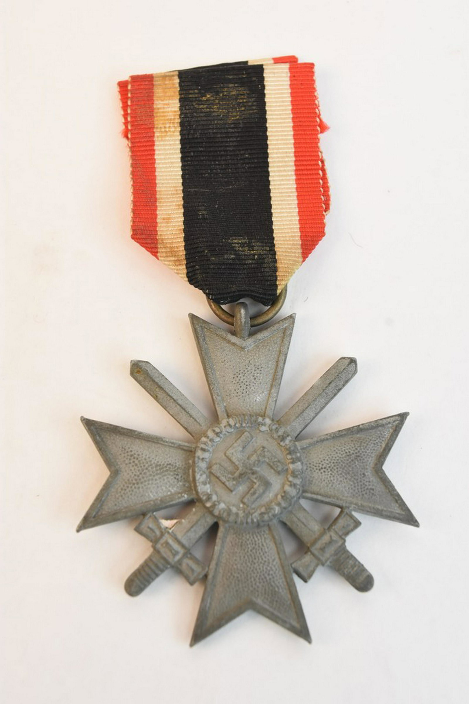 WWII German 2nd Class War Merit Cross: WWII German 2nd Class War Merit Cross with Swords. Ring marked #53. Please note: Scheerer McCulloch Auctioneers occasionally sells items of controversial nature with historical importance. All of our 