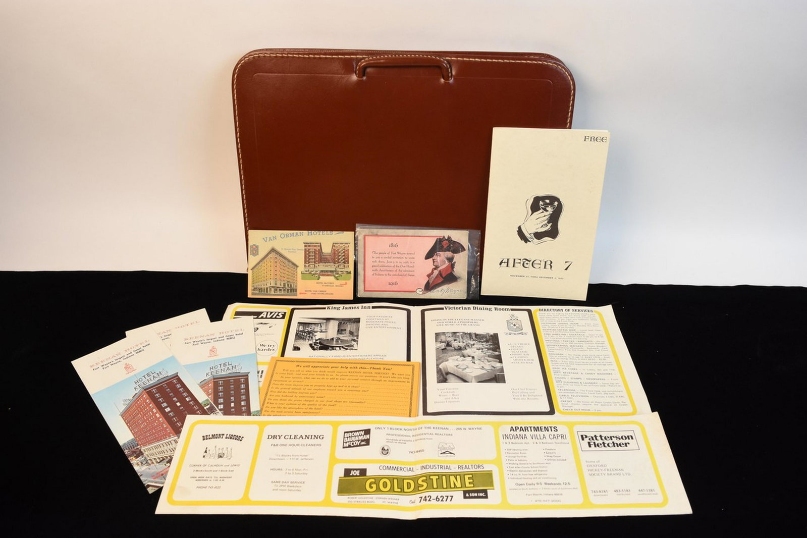 Fort Wayne Ephemera w/ Leather Portfolio: An assortment of Fort Wayne related ephemera including a postcard featuring two Van Orman hotels and an outline of the Centennial Celebration held in 1916. Also included is a Keenan Hotel Guest Folder