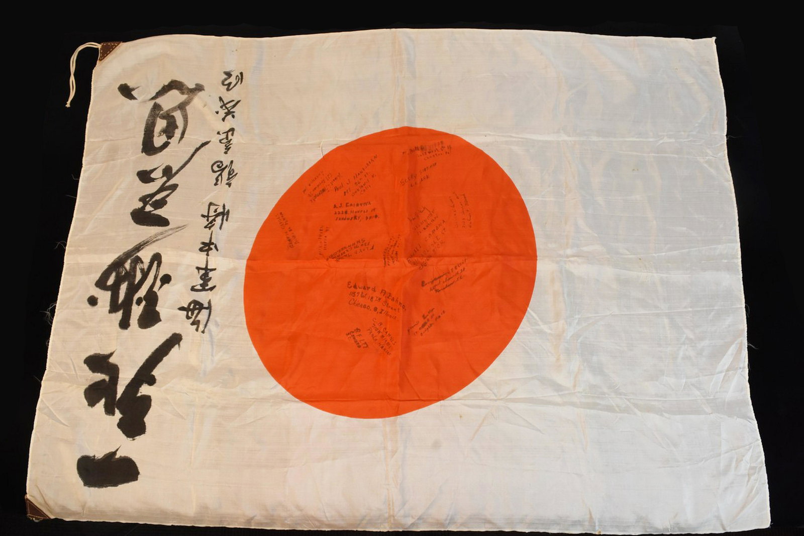 WWII Japanese Silk Flag: WWII Japanese silk flag captured by U.S. Marine Corporal George Geiges. He then had his squad add their names and addresses. Measures 38 inches by 28 inches. Contact our recommended 3rd party "for pro