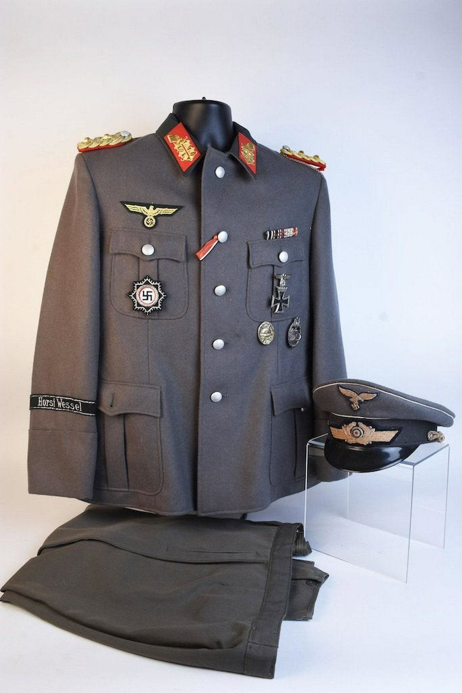 Costume of a WWII Field Marshall: Here we have a WWII Field Marshal uniform COSTUME. The uniform, hat, medals and elements of this ensemble is costume with the exception of the ribbon bar. Contact our recommended 3rd party "for profit