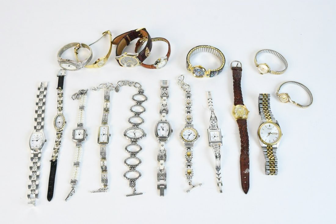 (17) Women's Fashion & Designer Watches: An assortment of seventeen ladies watches including Brighton. Other brands include Timex, Pulsar, and Guess. Gold tone, silver tone, and leather bands. Condition varies- timekeeping accuracy not guara