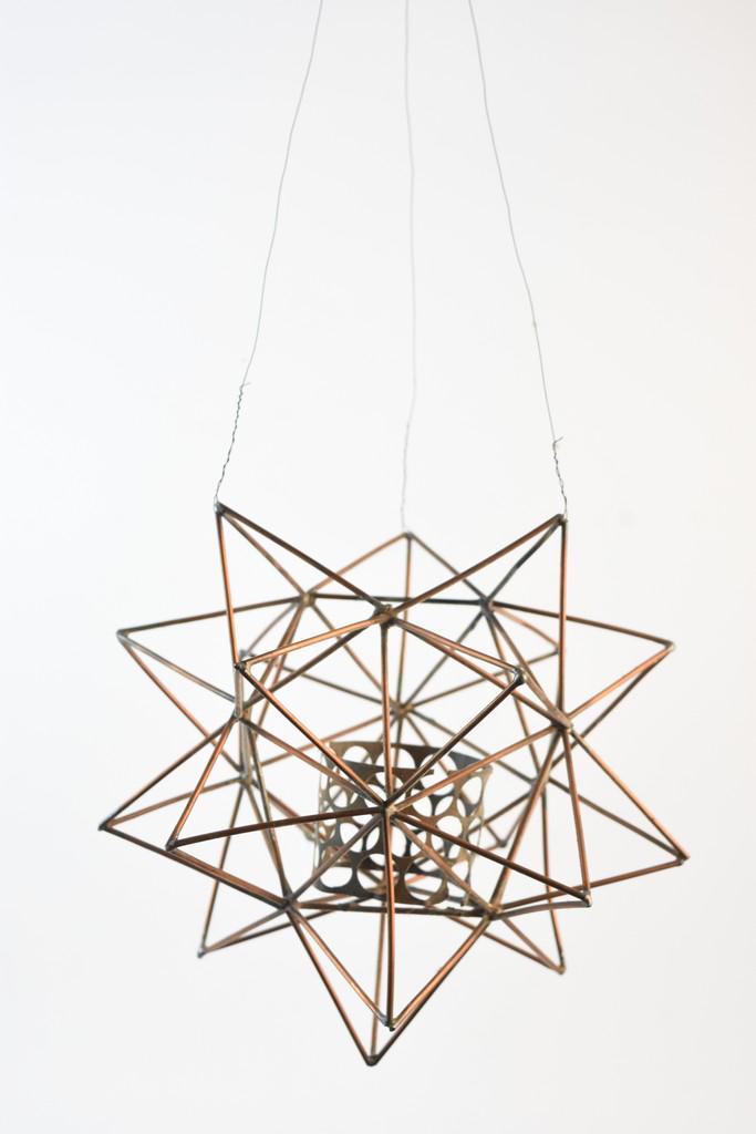 Contemporary Ceiling Hanging Art: A pair of contemporary art pieces including a ceiling mobile comprised of mirrored square & circle panels. Also included is a geometric copper tone hanging piece with a pierced collar at its center. P