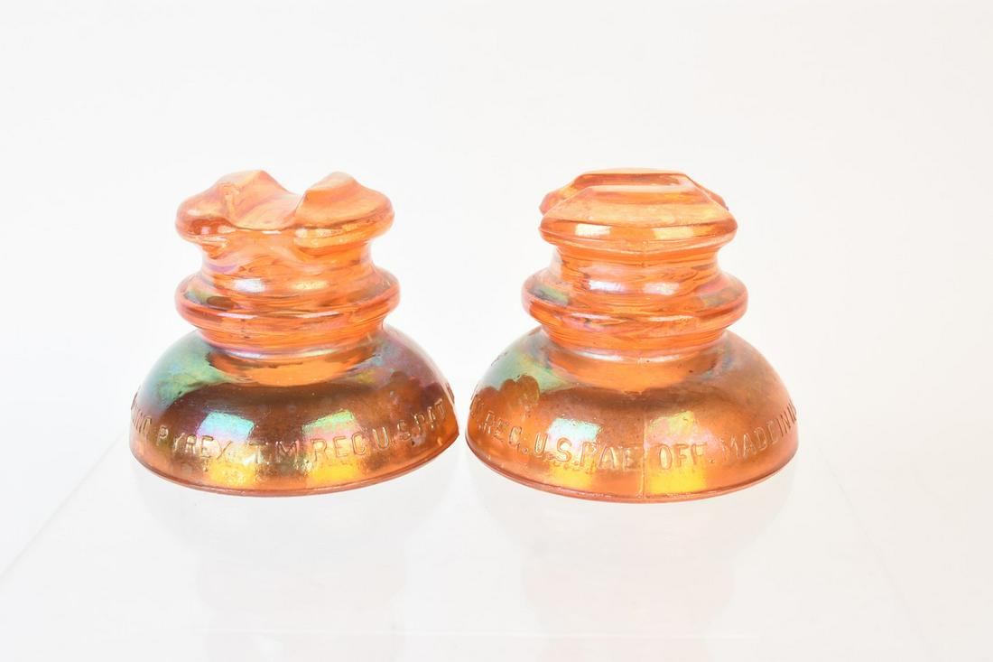 Pyrex Carnival Glass Insulator: A pair of amber carnival glass Corning Pyrex glass insulators. Marked along their bottom edge. One measures approx. 3" H x 4" W. Light surface markings and stains. Contact our recommended 3rd party "f