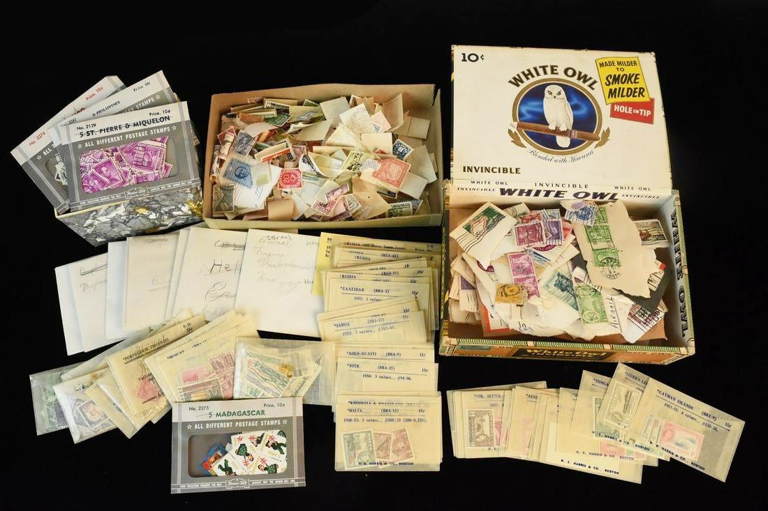 United States & International Postage Stamps: A large assortment of International and United States postage stamps- both unused and cancelled. Russia, Argentina, Germany, Australia, Nepal, Solomon Islands, Israel, Hungary, Czechoslovakia, Kenya, 