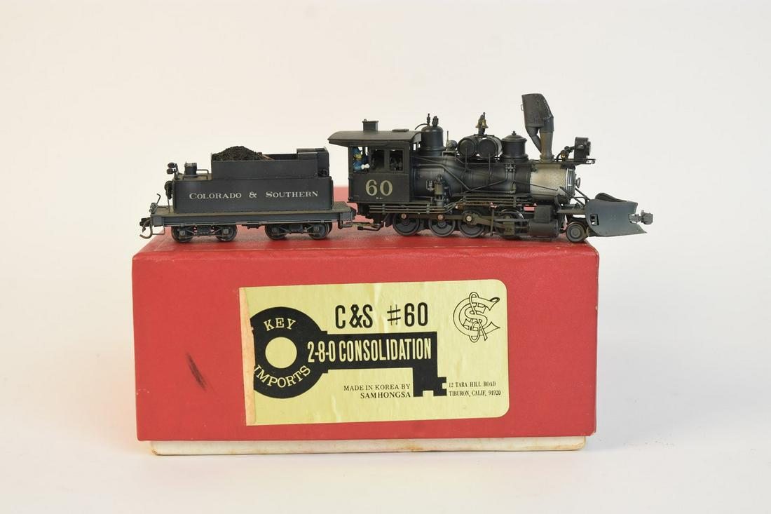Key Imports C&S 2-8-0 Consolidation Loco w/ Tender: Key Imports C&S 2-8-0 Consolidation locomotive No. 60 with coal tender. Samhongs Korea. Shows typical wear from running, train has NOT been tested. Comes in original box.