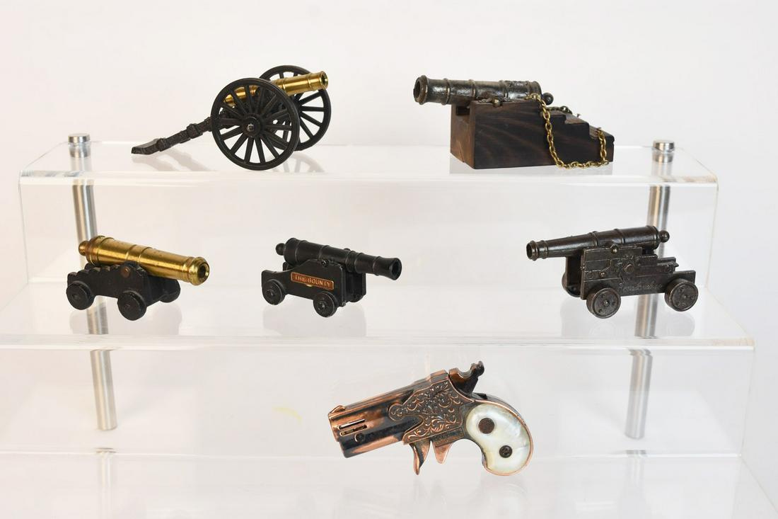 Cannon Figurines, Cap Gun, and Lighter Gun Dec 07, 2019 Scheerer McCulloch Auctioneers, Inc