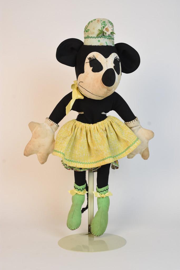 1930s Handmade Cloth Minnie Mouse Doll: A handmade cloth doll depicting Disney's Minnie Mouse with pie-eyes and pointed nose from a McCalls pattern #91 which was released by Disney using the original Charlotte Clark patterns. Wearing yellow