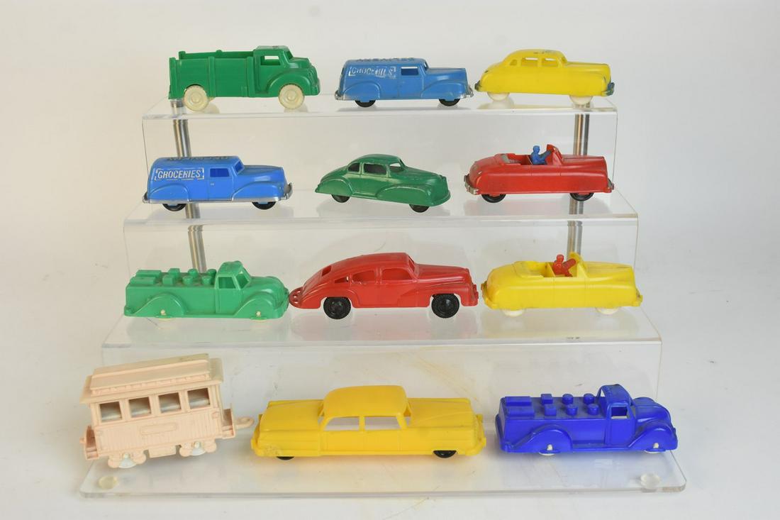 Toy Cars and Train Car: A selection of ten plastic cars & trucks; a plastic caboose; and a metal coupe. Items were produced by Wannatoys, London Toys, Ideal, Hasbro, Renwal, and Lapin. Caboose measures approx. 2.5" H x 1.5"