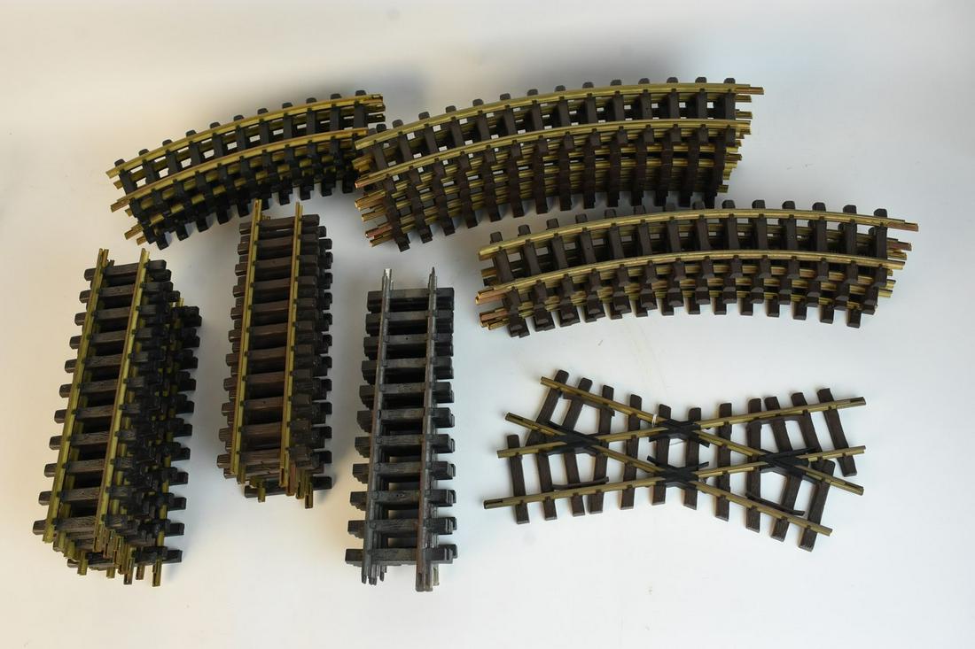 Assorted G Scale Track: An assortment of G scale track pieces by Bachmann, Aristo Craft, and LGB. Includes 16 straight 11" pieces, one LGB cross track, 5 curved Aristo Craft pieces, and 12 curved LGB pieces. Light discolorat