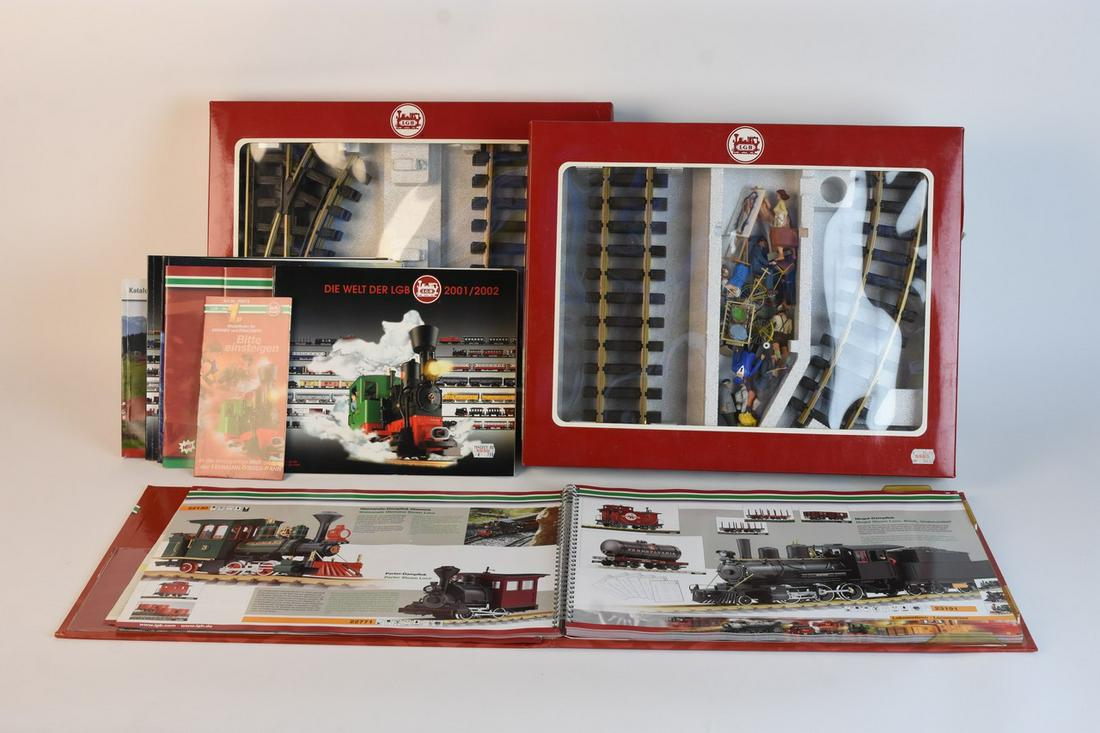 LGB G Scale Track, Figurines, and Catalogs: A selection of G scale LGB track with approx. (10) scenery figurines, (6) catalogs, and one large "The World of LGB" catalog. The track pieces include (2) curved pieces, (6) straight pieces, and (3) m