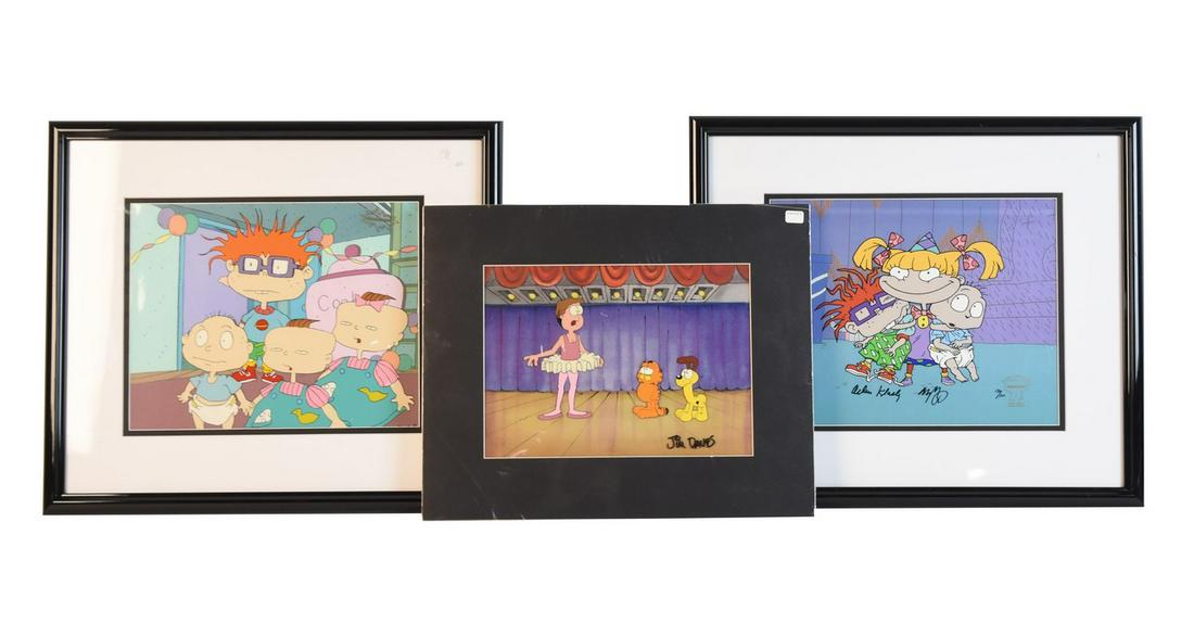 Jim Davis Signed Garfield Cell & 2 Rugrats: Two Rugrats Nickelodeon Production movie cells, one is a hand painted limited edition 130/300, comes with the Klasky Csupo Inc. COA. We also have a Garfield movie cell signed by Jim Davis featuring ch