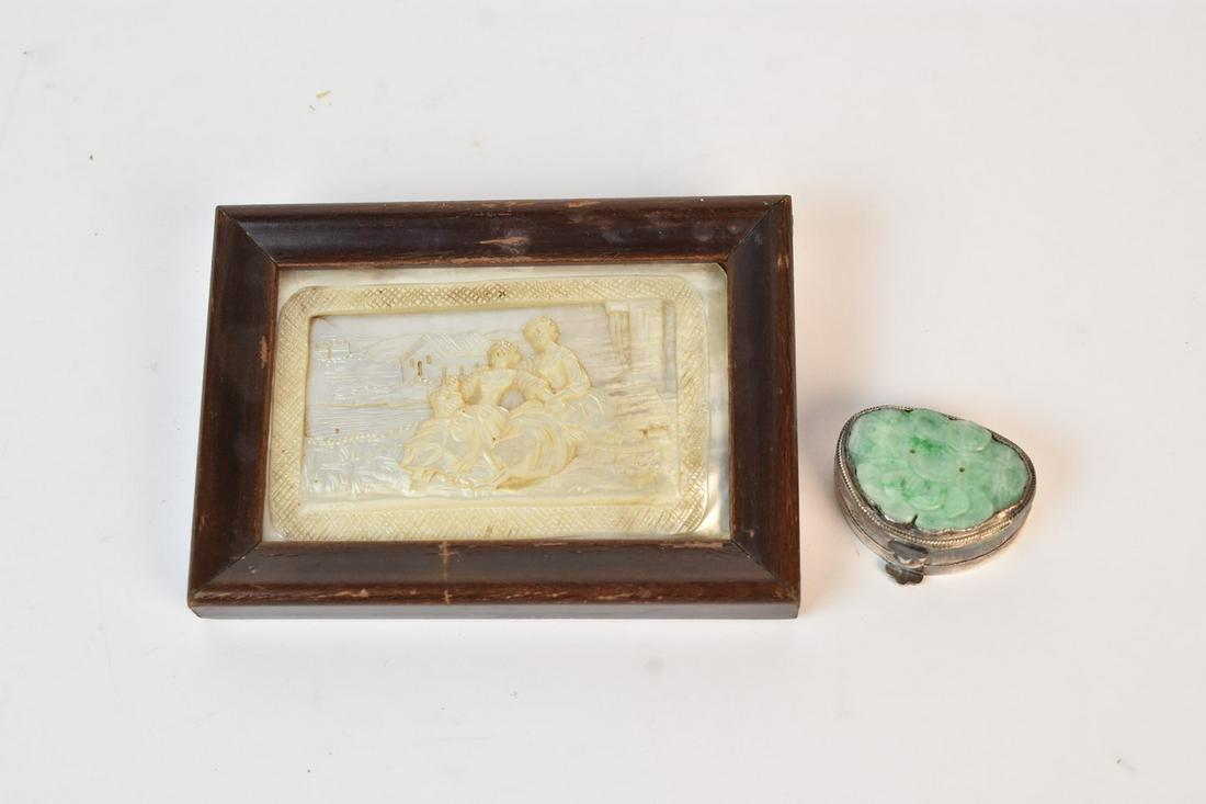 Jade Silver Tone Pill Box & Mother of Pearl Carving: A jade adorned silver tone etched pill box, illegible hallmark to underside. Also included is a mother of pearl carving encompassed by a wood frame with hanging wire affixed to the verso. Light discol